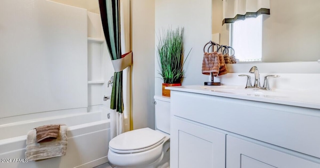 full bathroom featuring shower / tub combination, vanity, and toilet