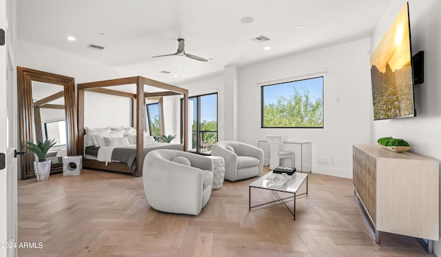 living room featuring ceiling fan and light parquet flooring