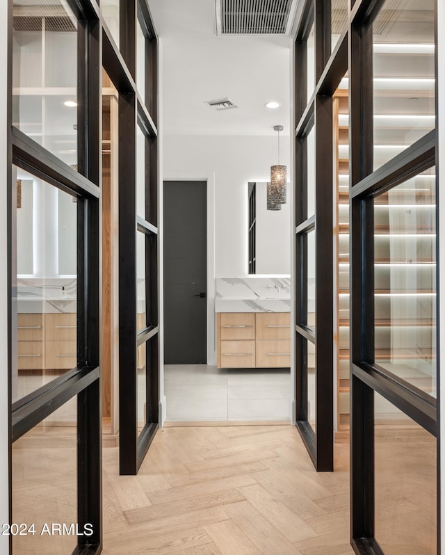 hallway with light parquet flooring