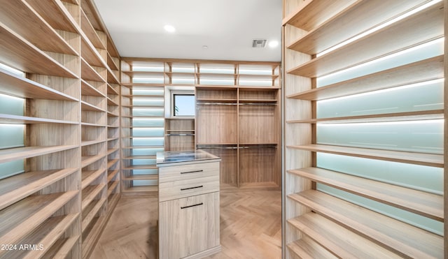 walk in closet featuring light parquet floors