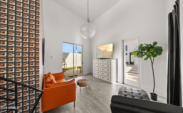 interior space featuring high vaulted ceiling and hardwood / wood-style flooring