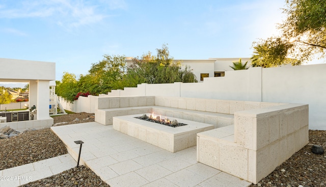 view of patio featuring a fire pit