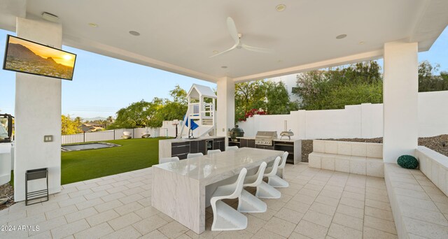 view of patio featuring a grill and ceiling fan