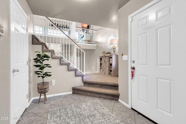 foyer entrance with tile patterned floors