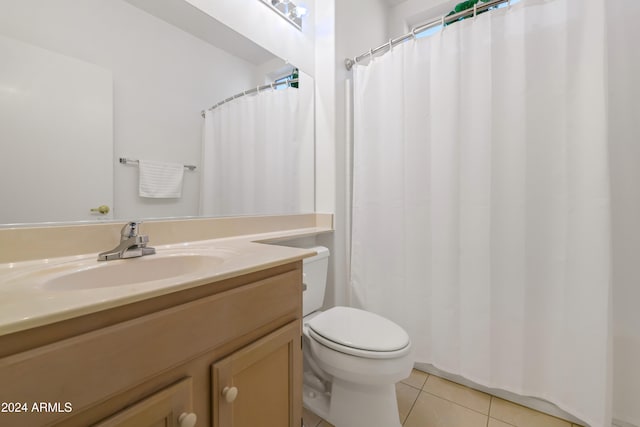 bathroom with tile patterned floors, vanity, and toilet