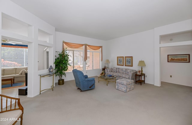 living room featuring light carpet and ceiling fan