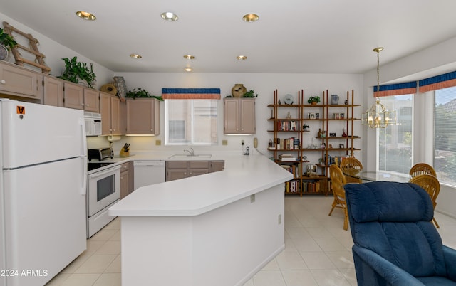 kitchen with sink, hanging light fixtures, a chandelier, white appliances, and light tile patterned flooring