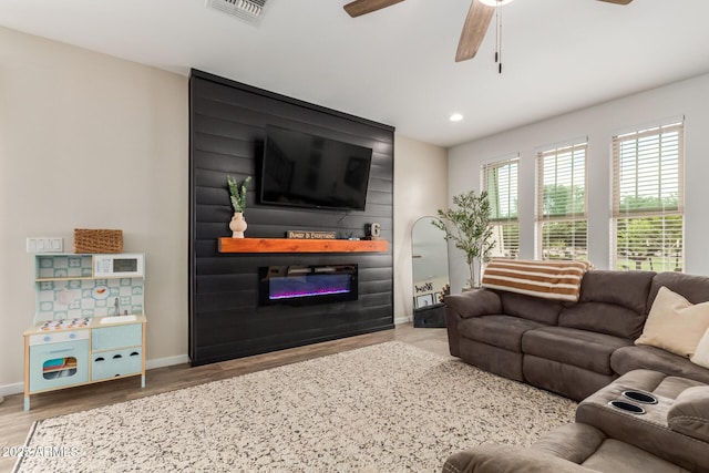 13380 N 148th Ave, Surprise, AZ 85379 - living area featuring ceiling fan, wood finished floors, a large fireplace, baseboards, and recessed lighting