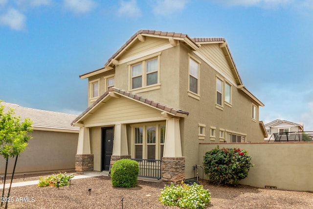 13380 N 148th Ave, Surprise, AZ 85379 - view of front of home featuring a tiled roof, fence, and stone siding