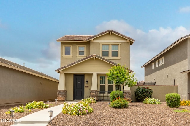 13380 N 148th Ave, Surprise, AZ 85379 - view of front facade featuring covered porch, fence, stone siding, stucco siding, and a tile roof