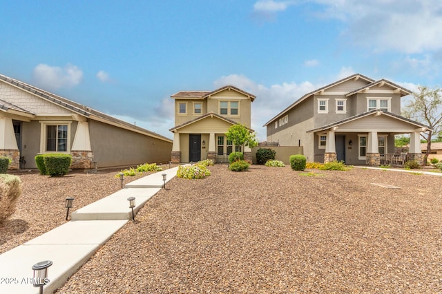 13380 N 148th Ave, Surprise, AZ 85379 - craftsman-style house with a porch, stone siding, and stucco siding
