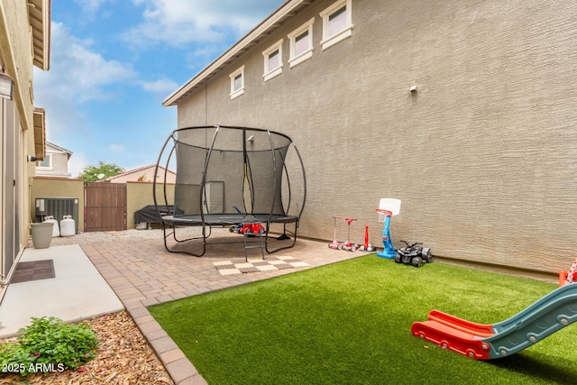 13380 N 148th Ave, Surprise, AZ 85379 - view of yard featuring a trampoline, a patio, and a playground