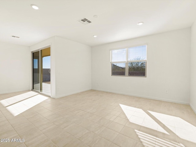 unfurnished room with light tile patterned floors