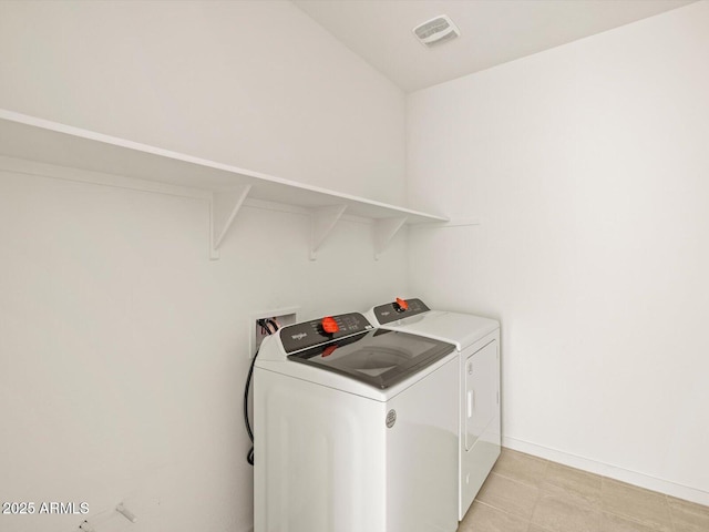 laundry area featuring washing machine and clothes dryer