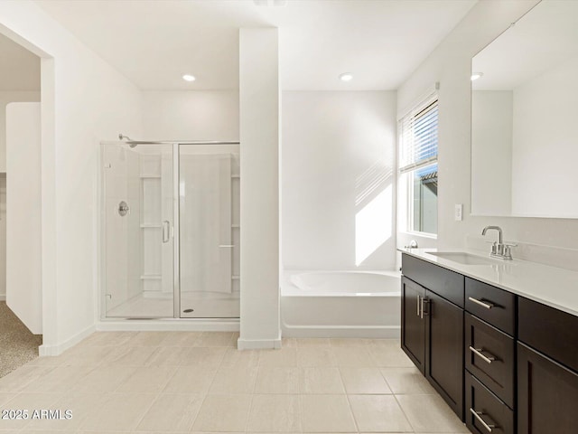 bathroom featuring vanity, independent shower and bath, and tile patterned flooring