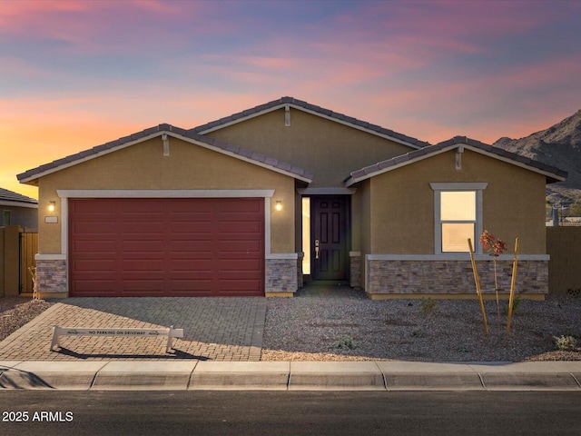 ranch-style home featuring a garage