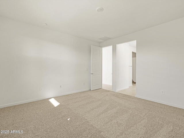 empty room featuring light colored carpet