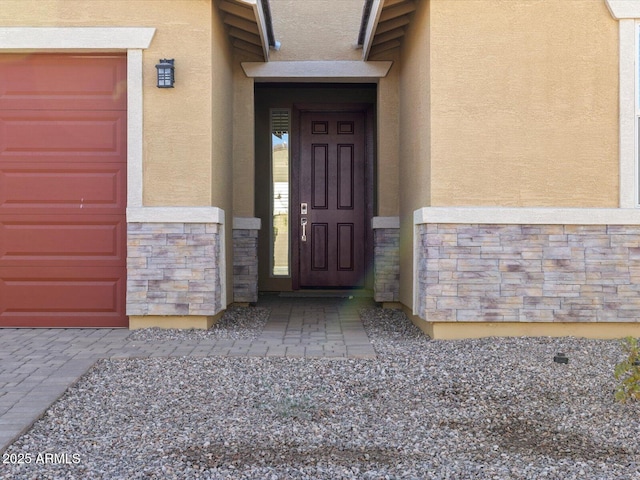 entrance to property featuring a garage