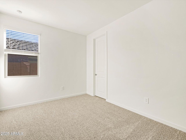 empty room with carpet flooring