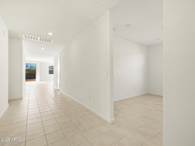 corridor featuring light tile patterned floors