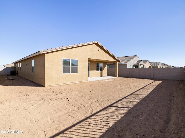 rear view of property with a patio area