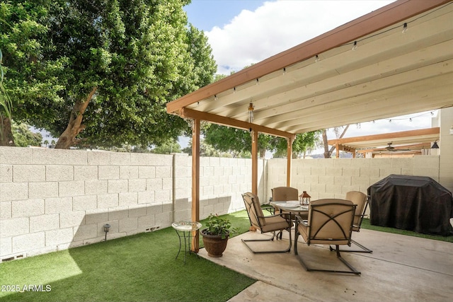 view of patio with a fenced backyard, grilling area, and outdoor dining area