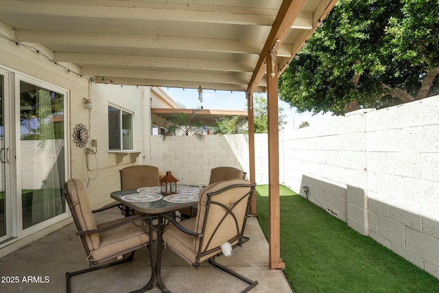 view of patio / terrace with outdoor dining area and a fenced backyard