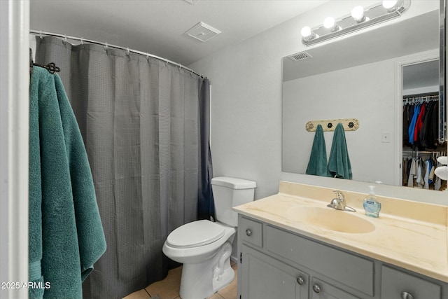 full bath with visible vents, toilet, tile patterned flooring, and vanity