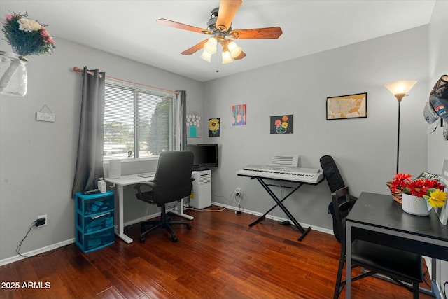 office space featuring a ceiling fan, baseboards, and wood finished floors
