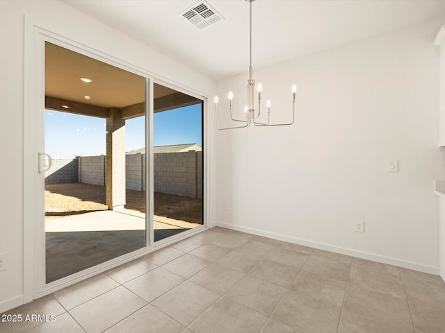 unfurnished dining area with light tile patterned floors and a chandelier