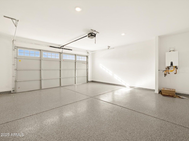 garage with tankless water heater and a garage door opener