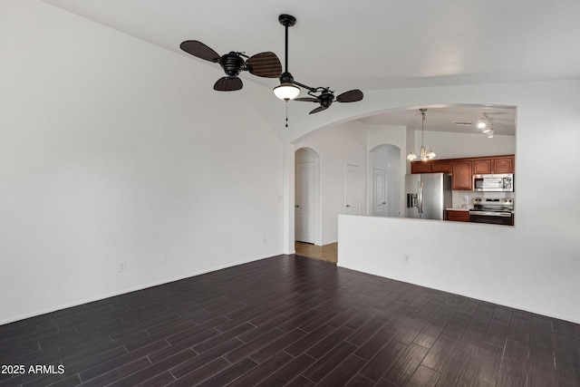 unfurnished living room featuring dark wood-type flooring, ceiling fan, and lofted ceiling