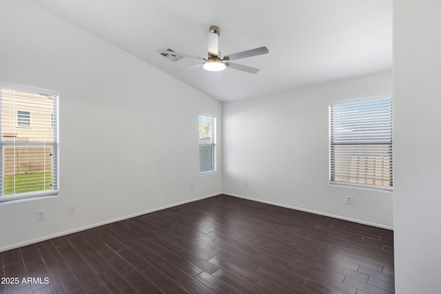 empty room featuring dark wood-type flooring, ceiling fan, and lofted ceiling