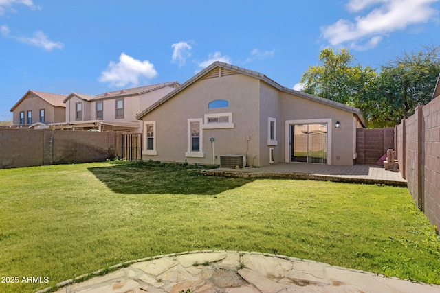 back of property featuring a patio and a lawn