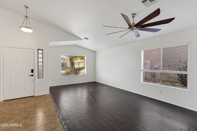 foyer entrance with lofted ceiling, dark hardwood / wood-style floors, and ceiling fan