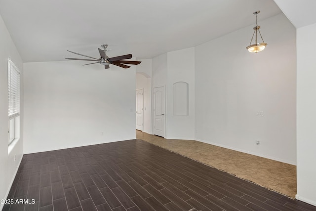 unfurnished room featuring ceiling fan and dark hardwood / wood-style floors