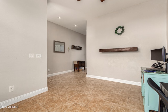 unfurnished living room with ceiling fan