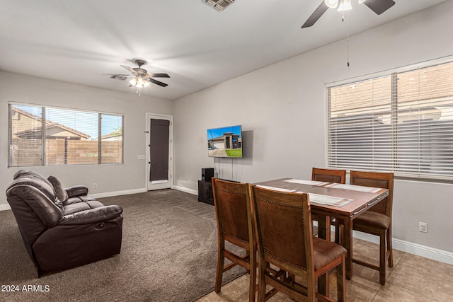 dining space featuring ceiling fan and carpet floors