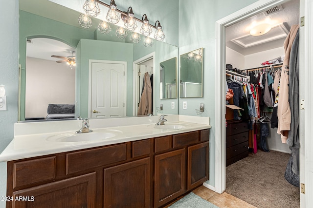 bathroom featuring ceiling fan, vanity, and tile patterned floors