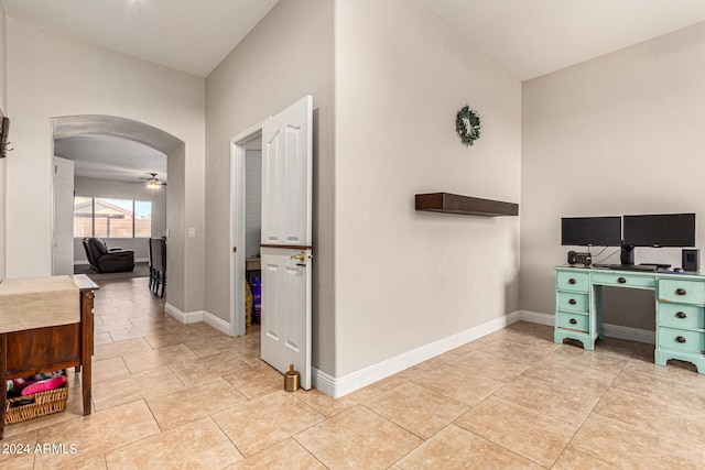 interior space with ceiling fan and light tile patterned floors