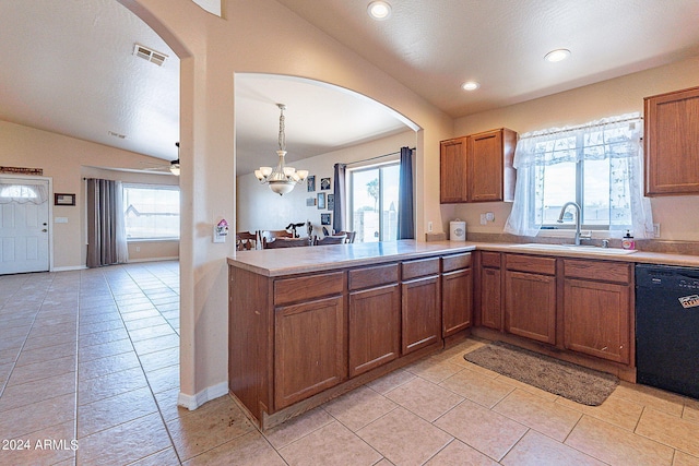 kitchen featuring pendant lighting, black dishwasher, sink, and a wealth of natural light