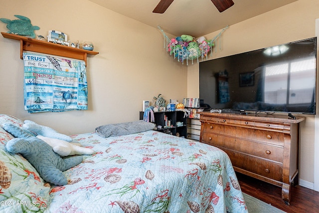 bedroom with ceiling fan and dark wood-type flooring