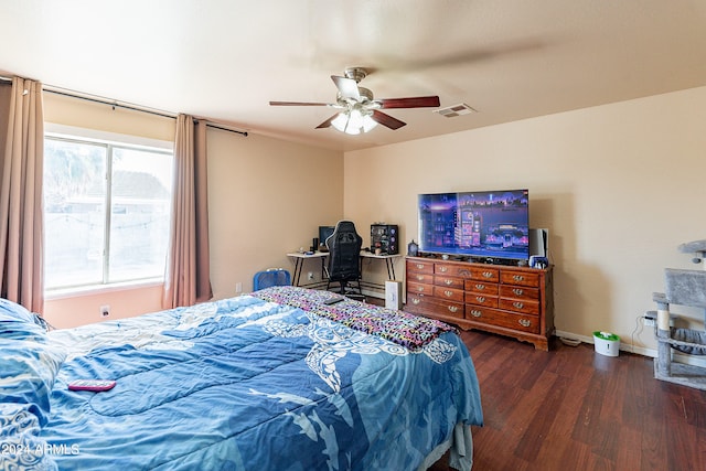 bedroom featuring ceiling fan and dark hardwood / wood-style floors