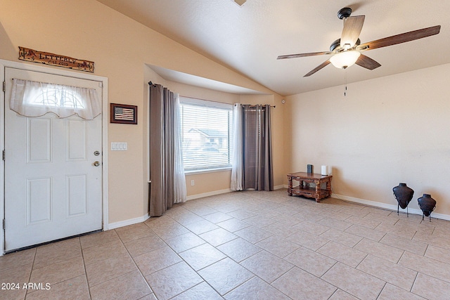 tiled foyer featuring ceiling fan, plenty of natural light, and vaulted ceiling