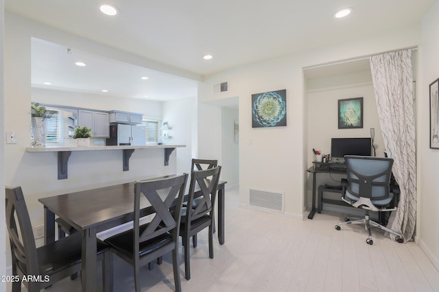 dining area with recessed lighting, visible vents, baseboards, and light wood-style floors