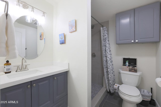 bathroom with vanity, toilet, a stall shower, and tile patterned flooring