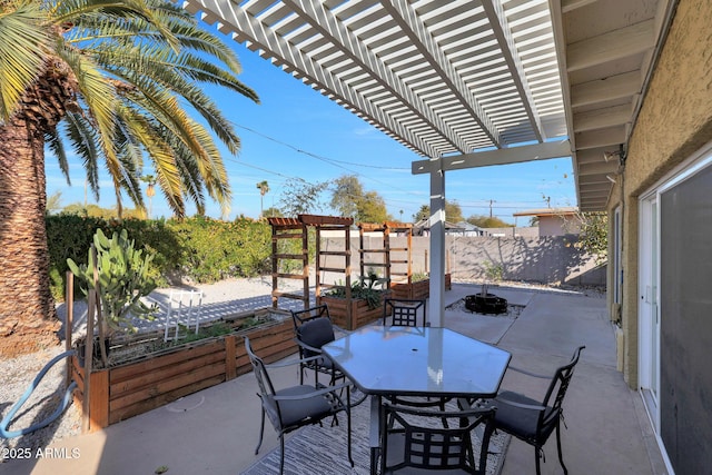 view of patio / terrace with a pergola, outdoor dining area, and fence