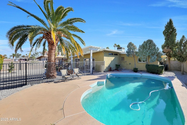 view of swimming pool with a fenced in pool, a patio area, a pergola, and fence