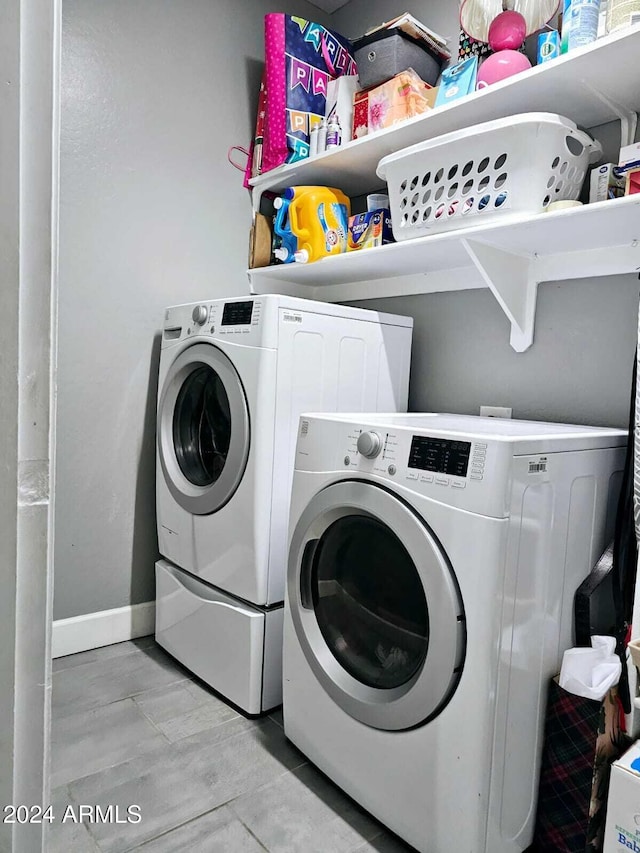 washroom with washer and clothes dryer