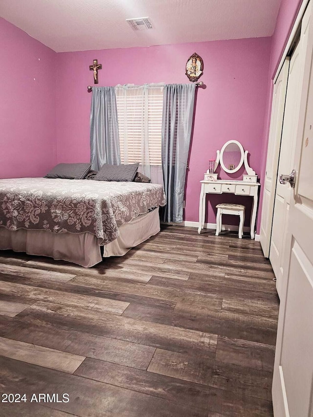 bedroom featuring a closet and hardwood / wood-style floors